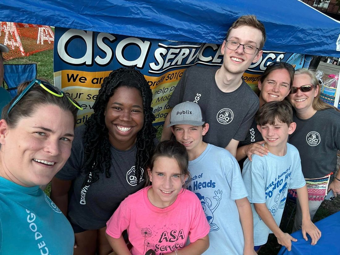 A group selfie of volunteers smiling